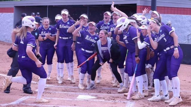 McKendree teammates await Lauren Smith at the plate as the Bearcats advance to the DII softball finals. 